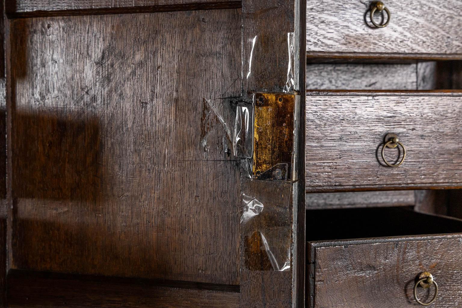 An impressive early 18th century Dutch oak geometric kussen cabinet with integra For Sale 4