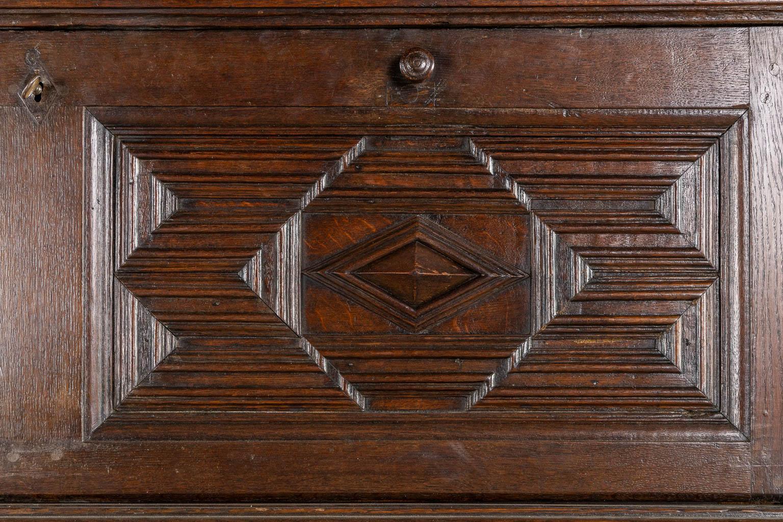 An impressive early 18th century Dutch oak geometric kussen cabinet with integra For Sale 1