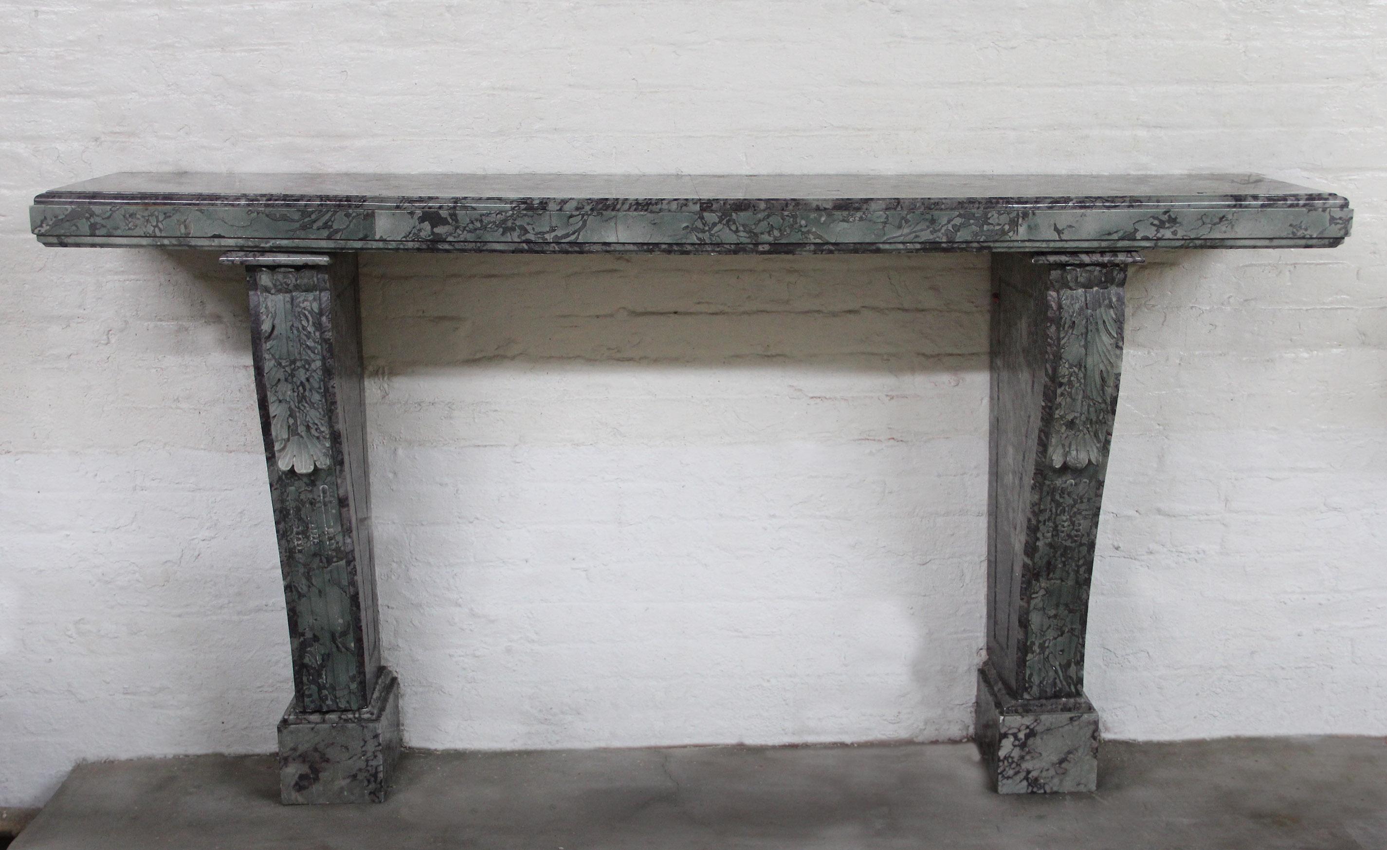 An Impressive Early 20th Century Hand Carved Marble Console

The long beautiful Breccia Verde marble top above two shaped, carved legs standing on rectangular bases.