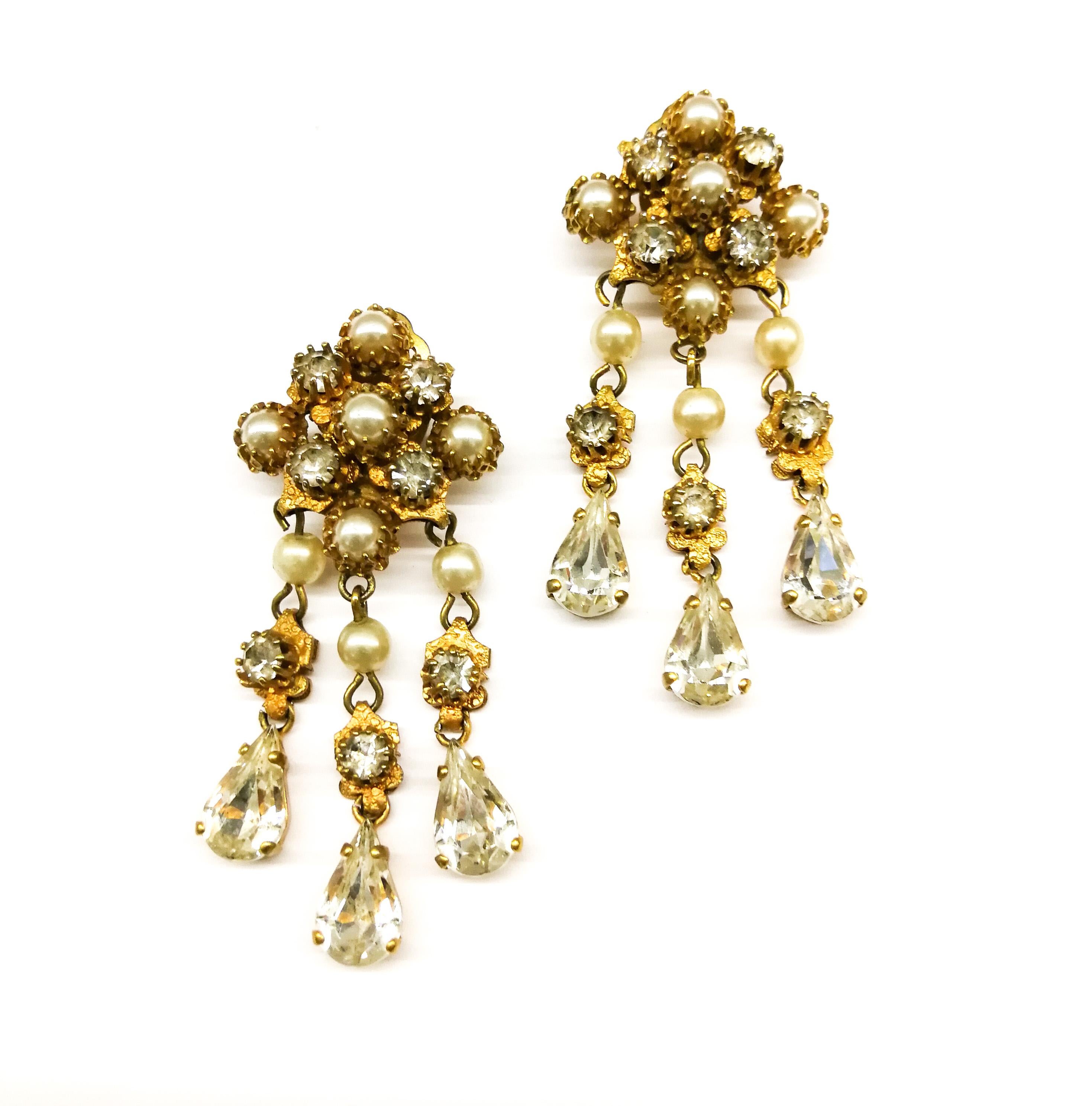 Baroque An impressive 'festoon' necklace and matching earrings, Christian Dior, c. 1954.