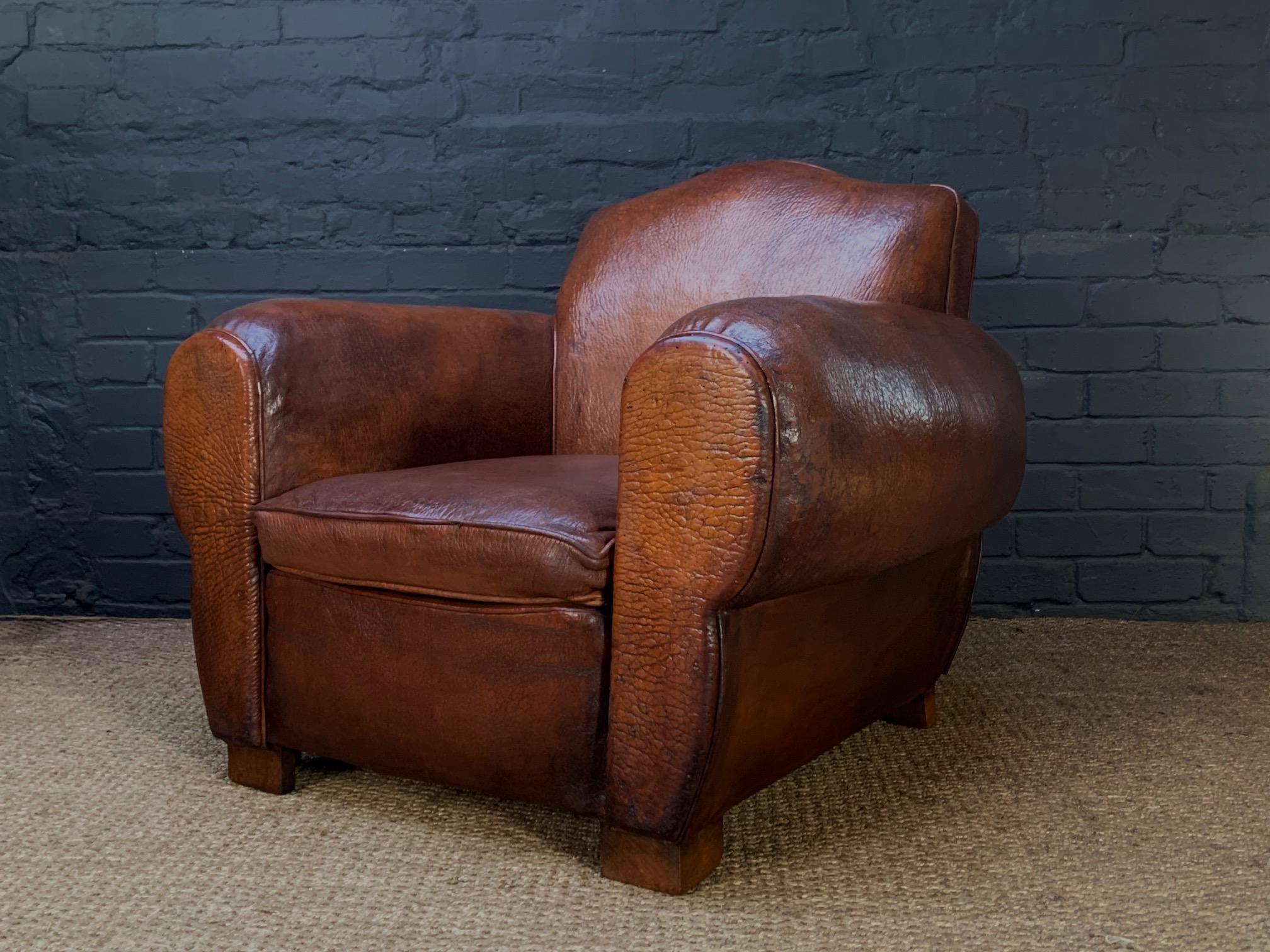 An Impressive French Leather Club Chair, Chapeau du Gendarme Model, Circa 1920's, Le Giant Model, with over-stuffed cigar arms

This impressive chair is one of the first French leather club chairs to be made in this form. Giant models are of the