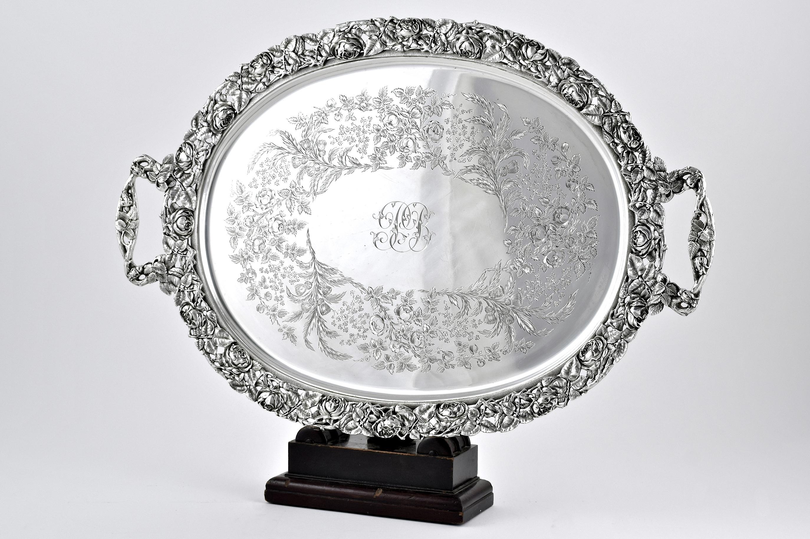 With Hallmarks for Mappin & Webb, London 1918

The fine & heavy quality cast boarder and handles decorated with roses, the centre of the tray engraved with roses, thistles & clover. The very centre of the tray engraved with script initials