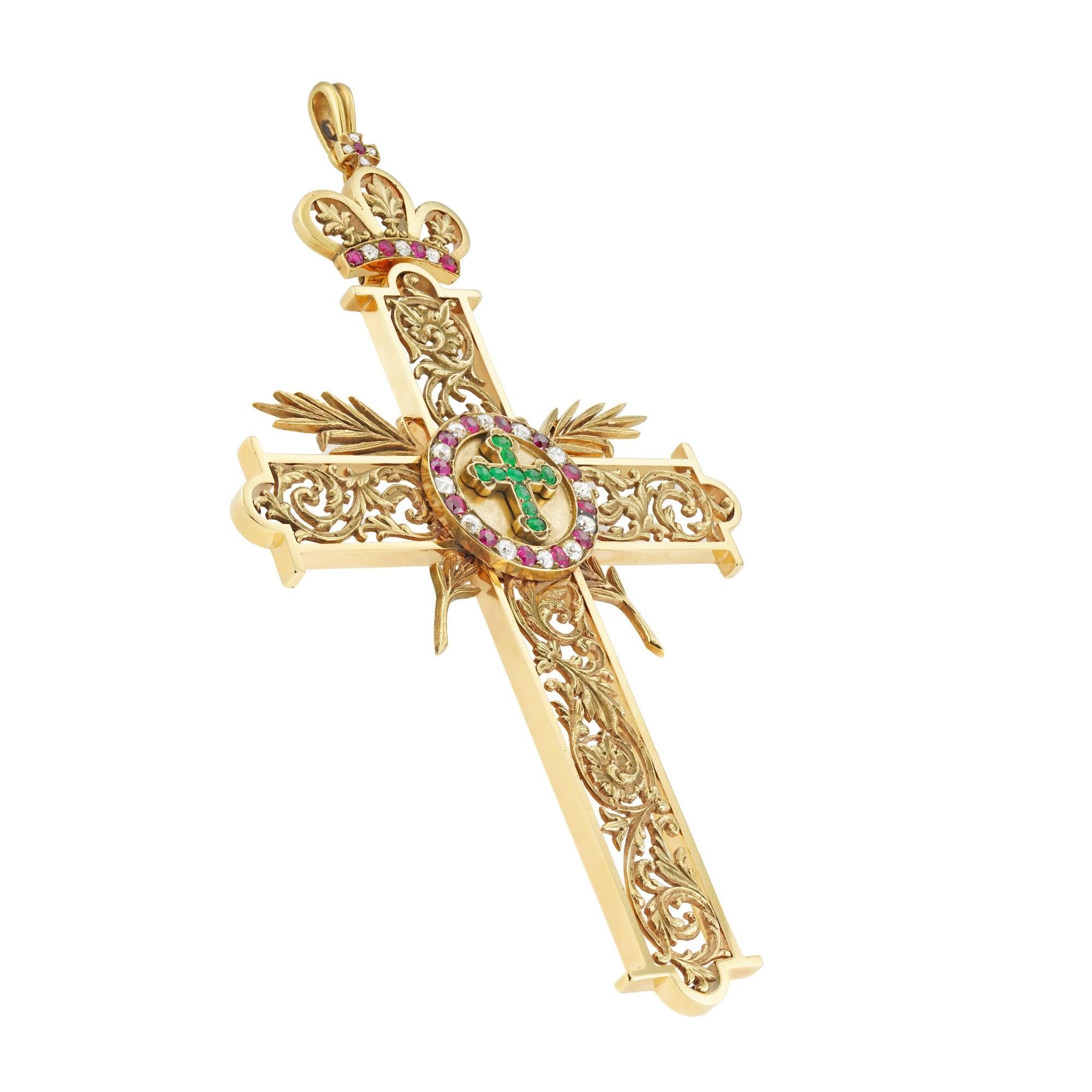 An impressive late 19th century pectoral cross, to the centre a circular plaque with an emerald-set Latin cross with fleur-de-lys cardinal points, the emeralds estimated to weigh ½ carat in total, surrounded by ruby and old-cut diamond-set frame,