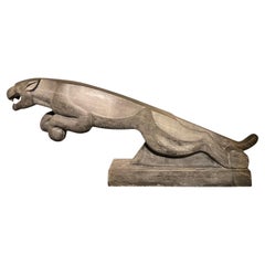 An impressive mid 20thC. life size Art Deco stone Jaguar.