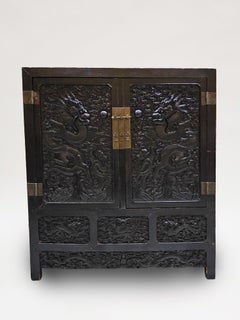 An Impressive Pair of 19th Century Chinese Carved Dragon Cabinets