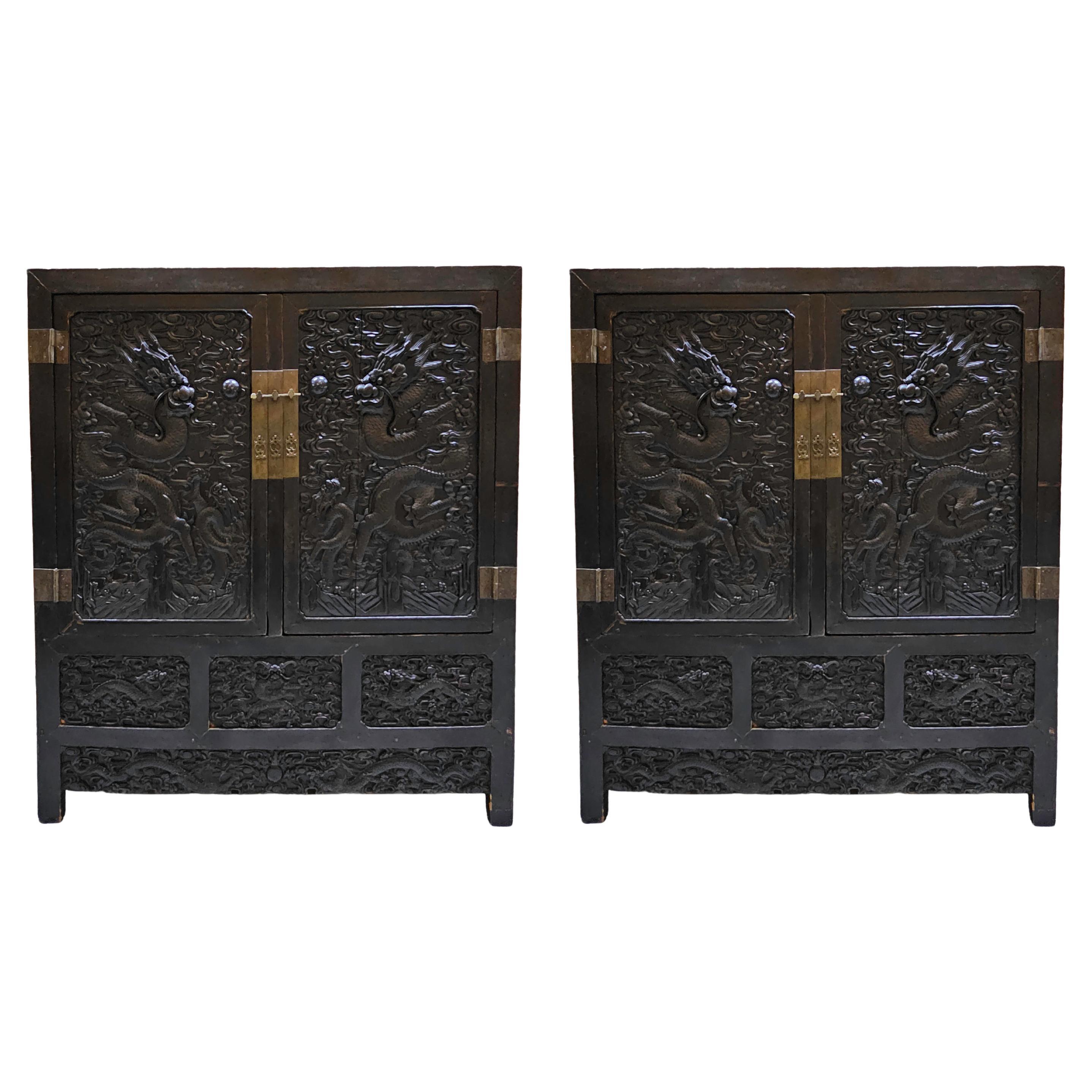 An Impressive Pair of 19th Century Chinese Carved Dragon Cabinets
