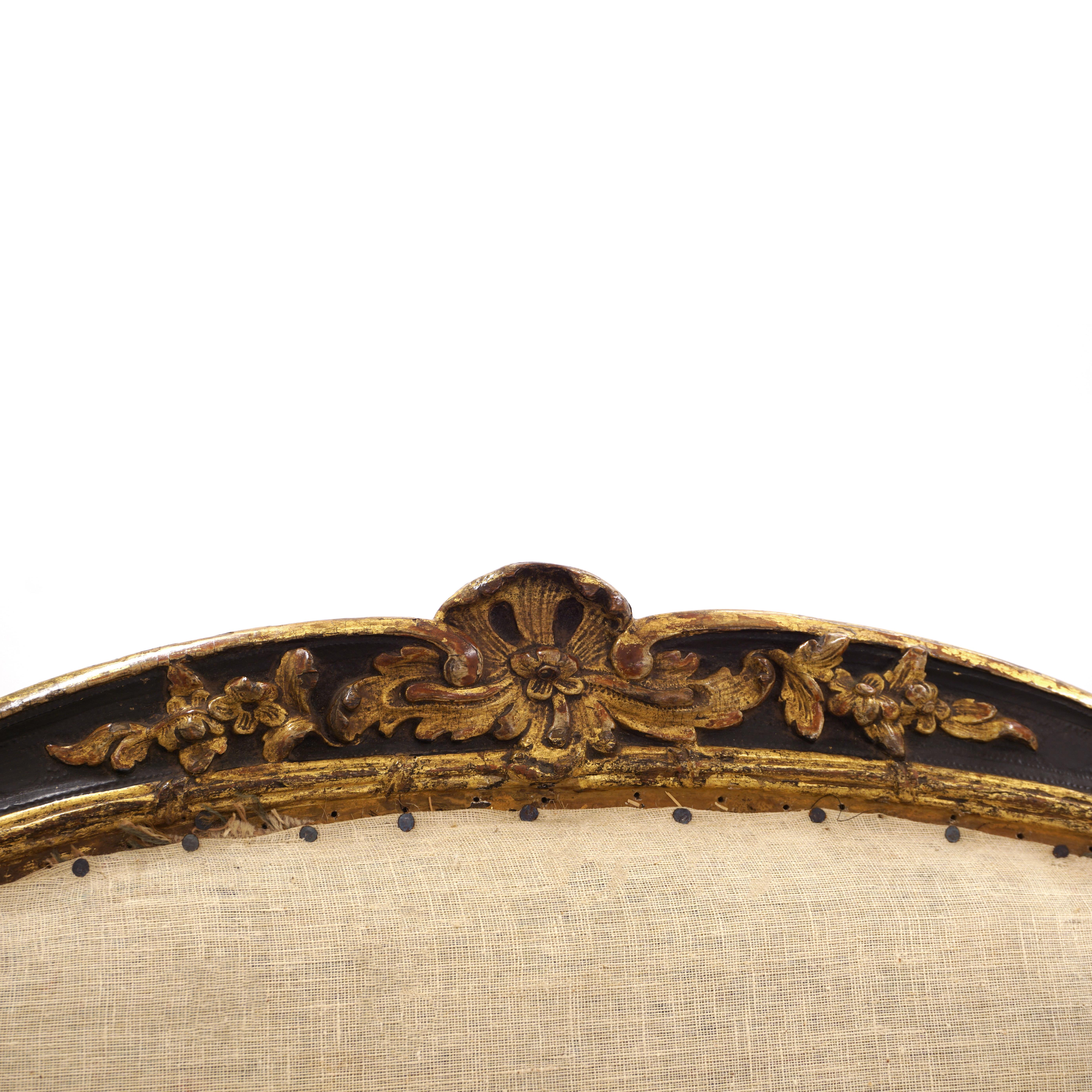 Wood Impressive Pair of French Mid 18th Century Black and Gilt Rococo Armchairs For Sale