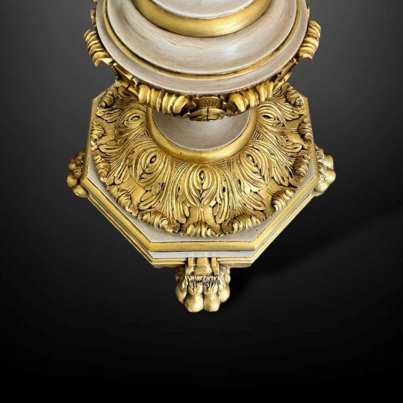 Gilt An impressive pair of gilt and painted uplighters For Sale