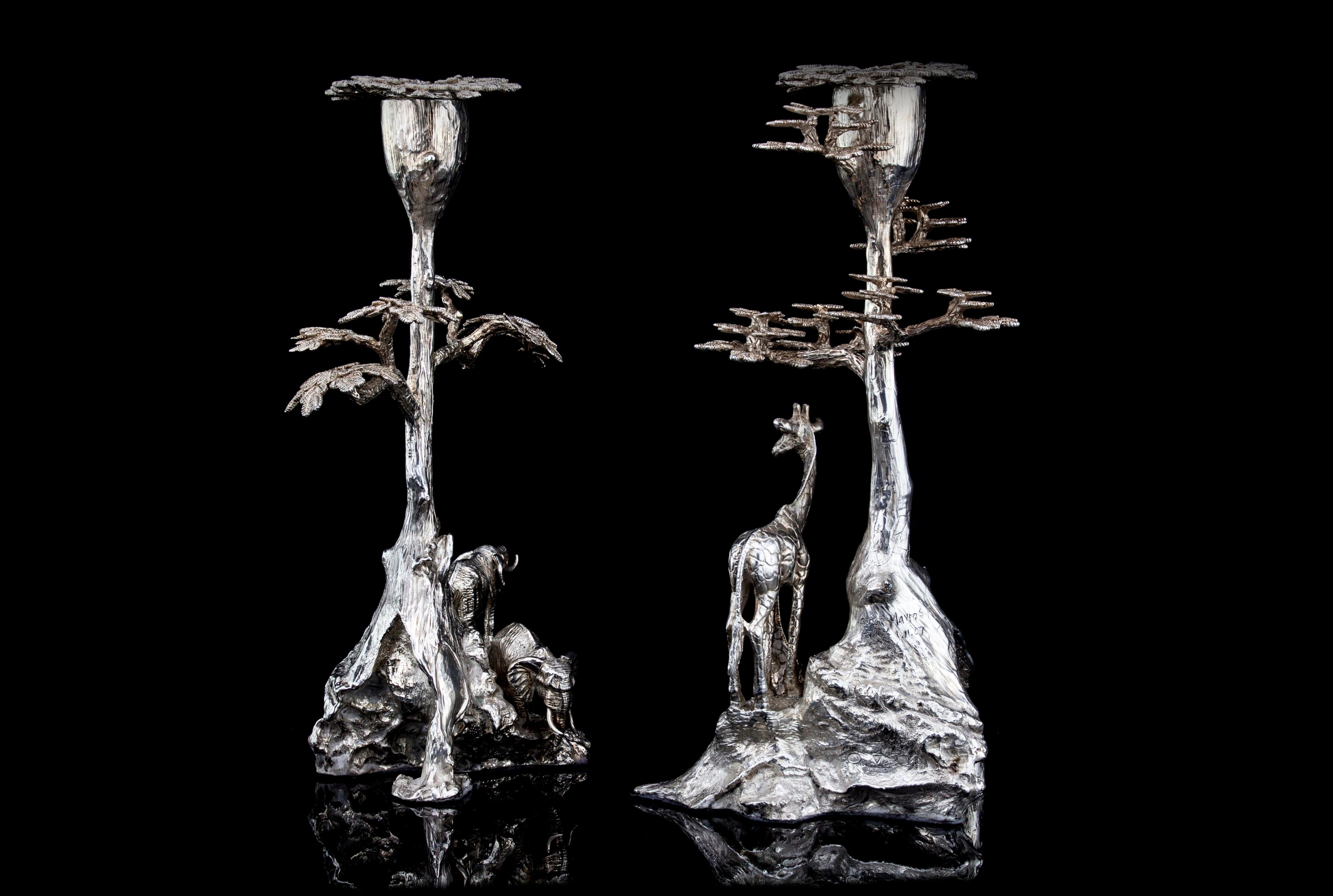 An impressive pair of Safari candlesticks
One candlesticks is with 2 giraffes and root tree and another one is with 2 elephants and root tree.
Made in Africa, Zimbabwe, 2007
Imported to England, 2015
Made by Patrick Mavros
One of the