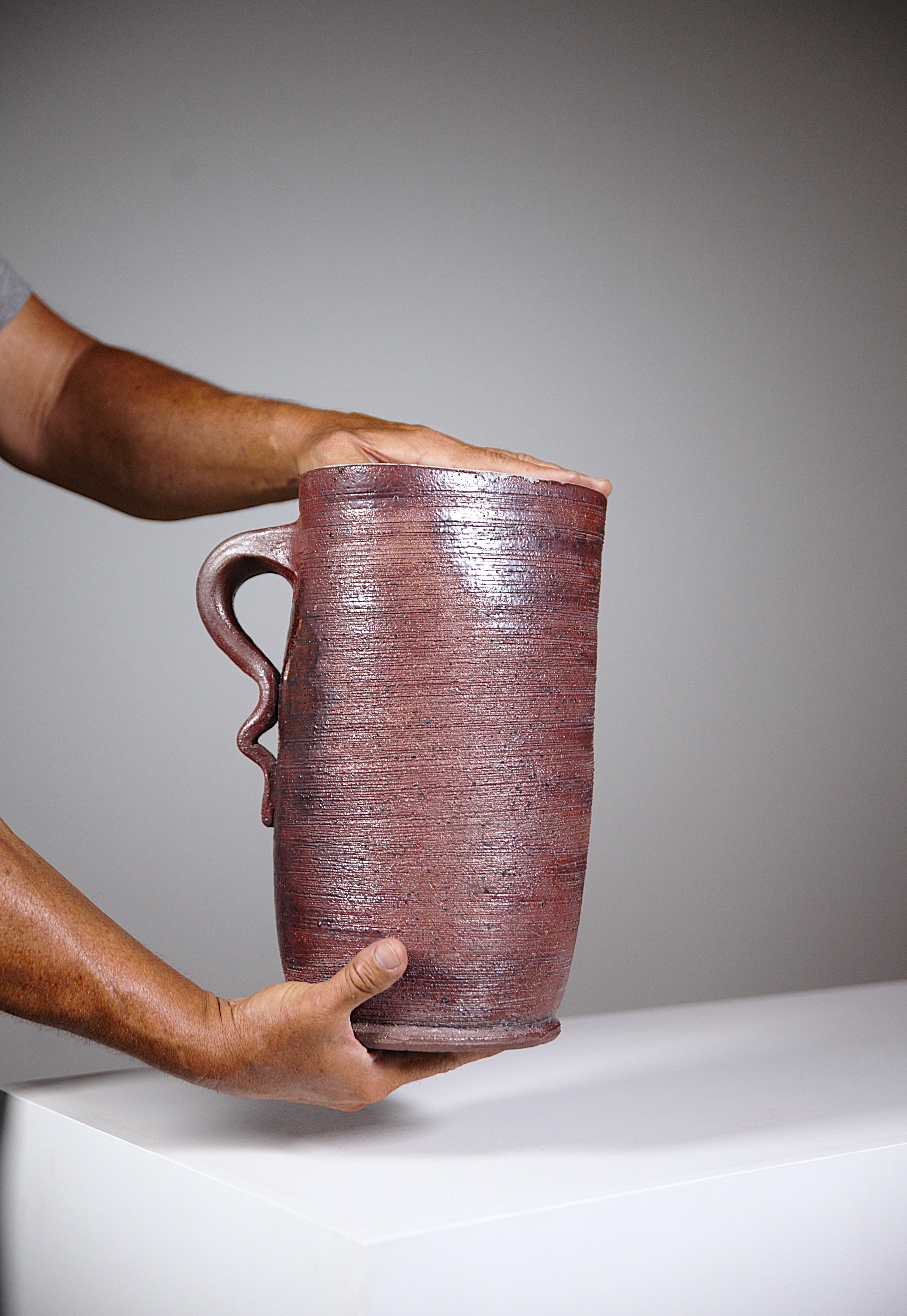 An Impressive Rustic Stoneware Pitcher by Cécile Dein Brittany Fance 1960's

Pretty stoneware color and pretty wavy handle.

Triangular shape

More than a pitcher, a true sculpture !!!

Large-sized piece but very elegant.

Signed under.

In very