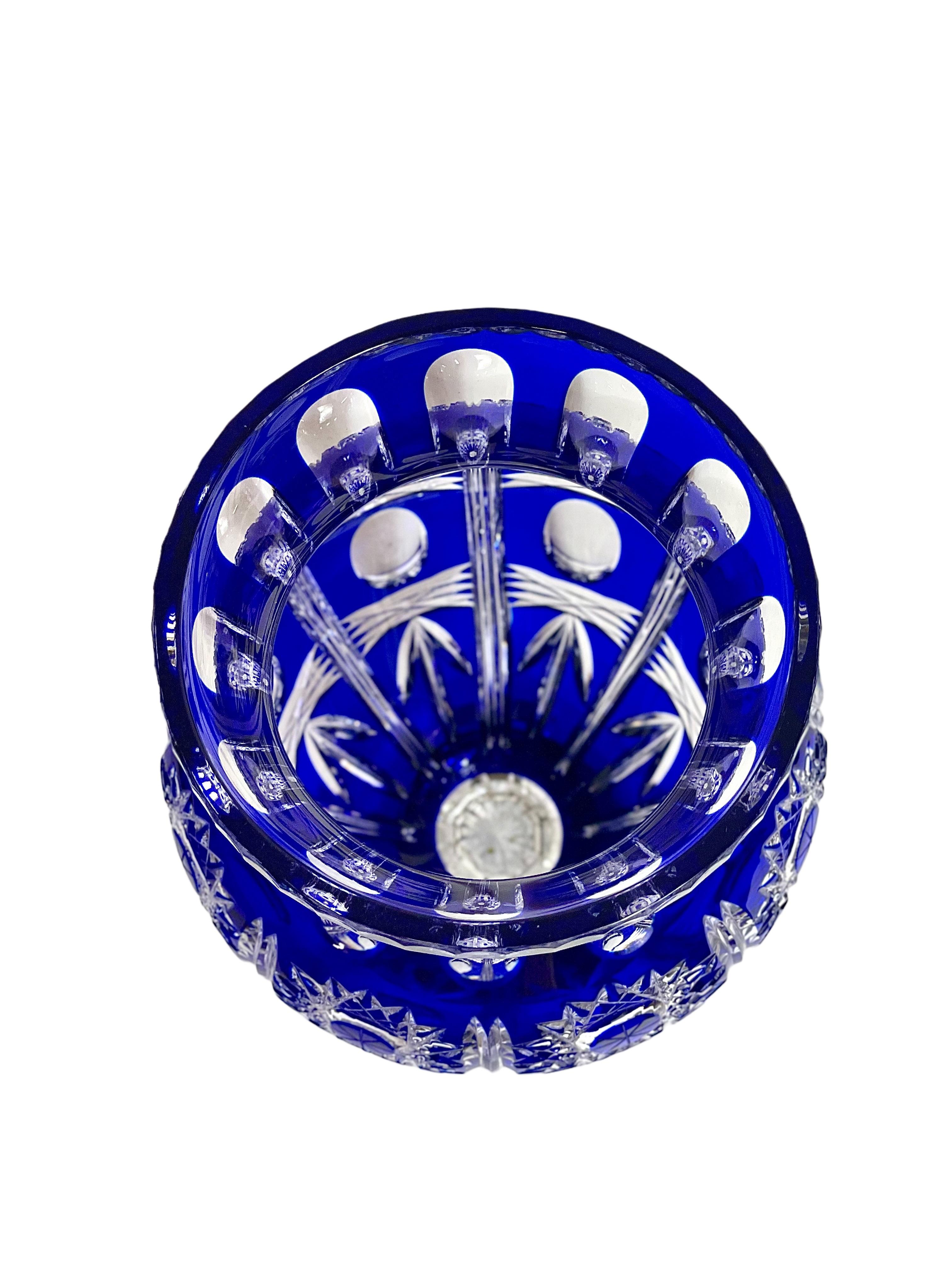 This impressive Etzel crystal vase in cobalt-blue overlay is from the famous Compagnie des Cristalleries de Saint Louis in Lorraine, the oldest glass manufacturer in France, dating back to 1586. Hand-cut with sun motifs, oval lozenges with bevelled