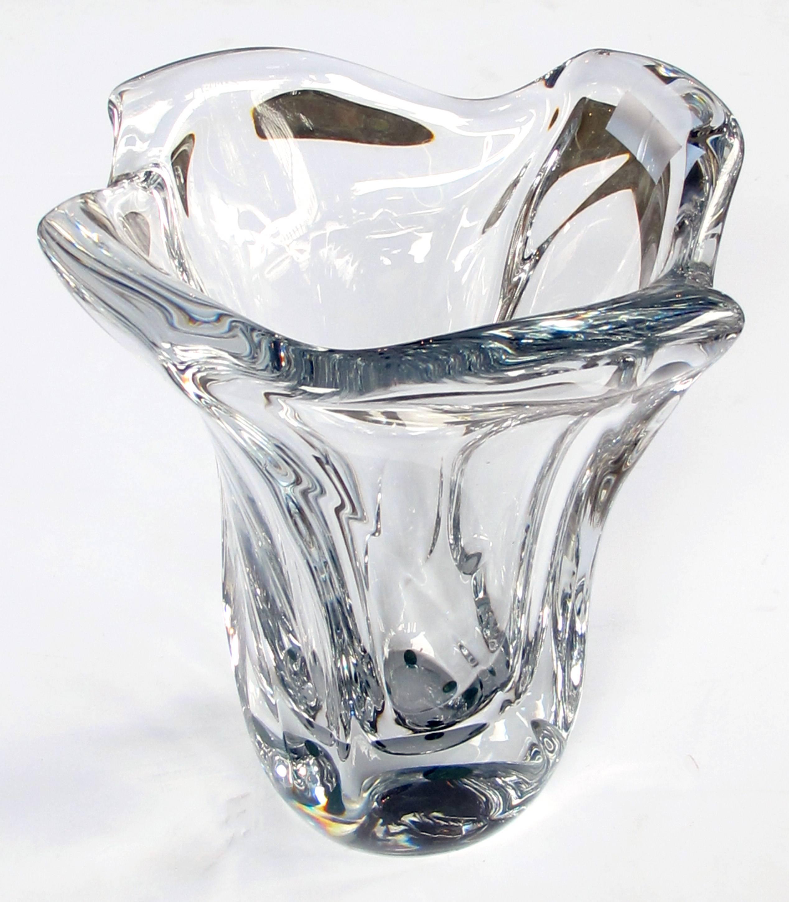 Of large-scale, the shimmering crystal vase with lobed mouth tapering to the base; with acid etched signature 'Daum France' separated by the cross of Lorraine indicating early production pieces, 1945-1950.