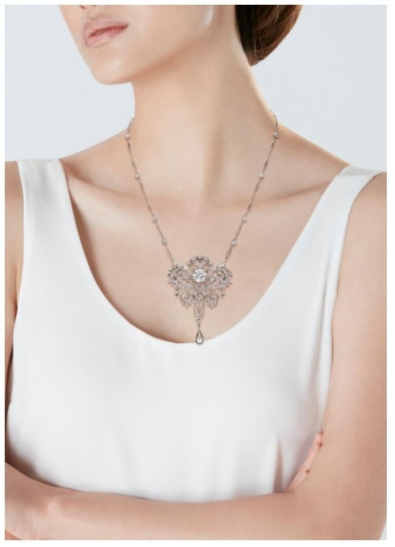 An Incredible Belle Époque Diamond Pendant Necklace Brooch.  Round old-cut and single-cut diamonds, seed pearl, platinum, detachable pendent can be worn as a brooch.
Diamonds: 1 old-cut diamond measuring approximately 9.01 - 8.80 x 5.18 and weighing