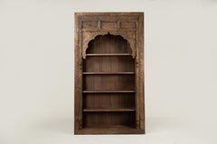 An Indian Carved Arch Modified into Bookshelf