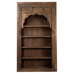 An Indian Carved Arch Modified into Bookshelf