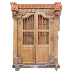 Antique An Indian Doorway Ensemble with Two sets of Barred Doors