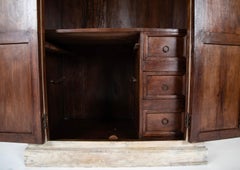 An Indian Painted Teak "Almirah" with Carved Panels