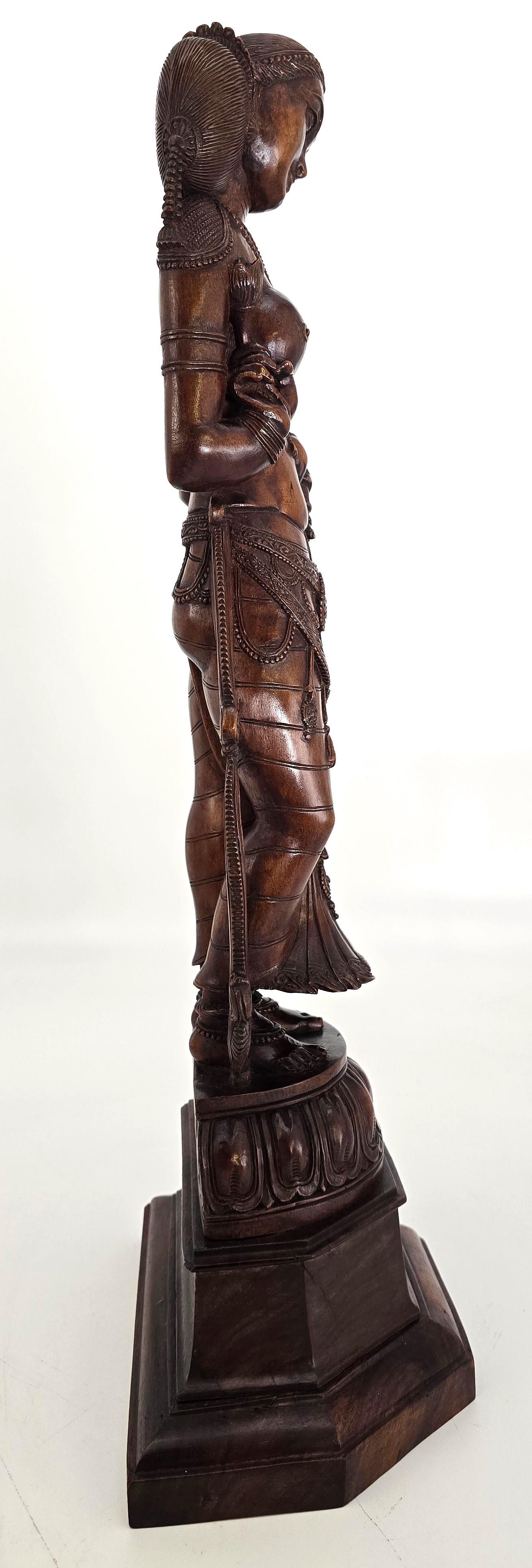 Sandalwood An Indian Raj period carved figure of the Goddess Parvati, circa 1900 For Sale