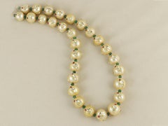 An Indian South Sea pearl necklace inlaid in 24K Gold, Diamond, Rubies & Emerald