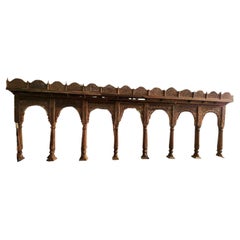 An Indian Wooden Arcade with Seven Arches and an Overhanging Eve