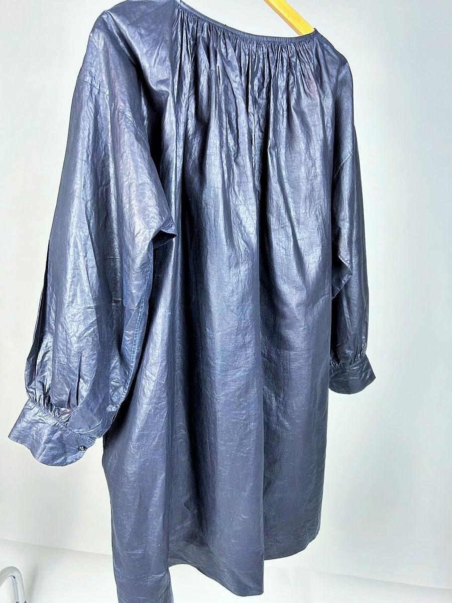 Second half 19th century
France
A Blouse Biaude for a french worker in indigo-dyed glazed cotton, which has retained its original finish. A rare example of French folk art, this type of blouse with festive facings was worn by men over their shirts