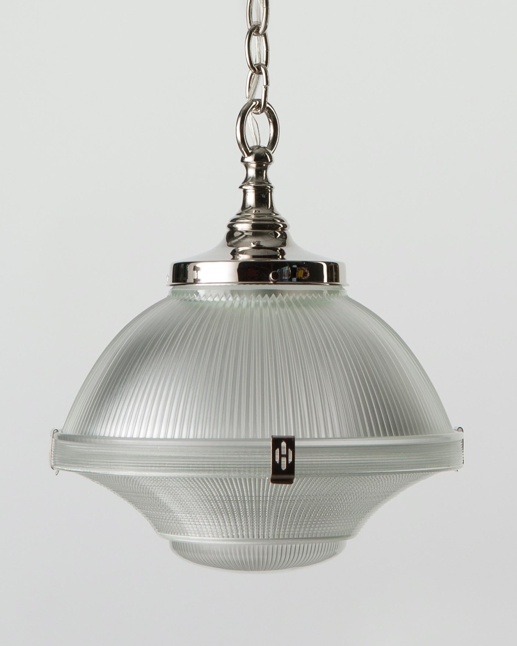 AHL3760
A three part holophane pendant, the vintage 1930s glass suspended from new polished nickel fittings made in the Remains Lighting Co. workshop. The top pieces are held together with decorative clips and the original bottom diffuser is