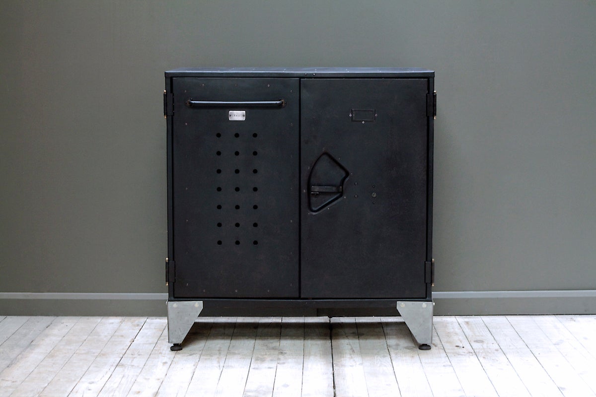 Industrial engineer's cabinet with a variety of quirky features and design elements. Marked 
