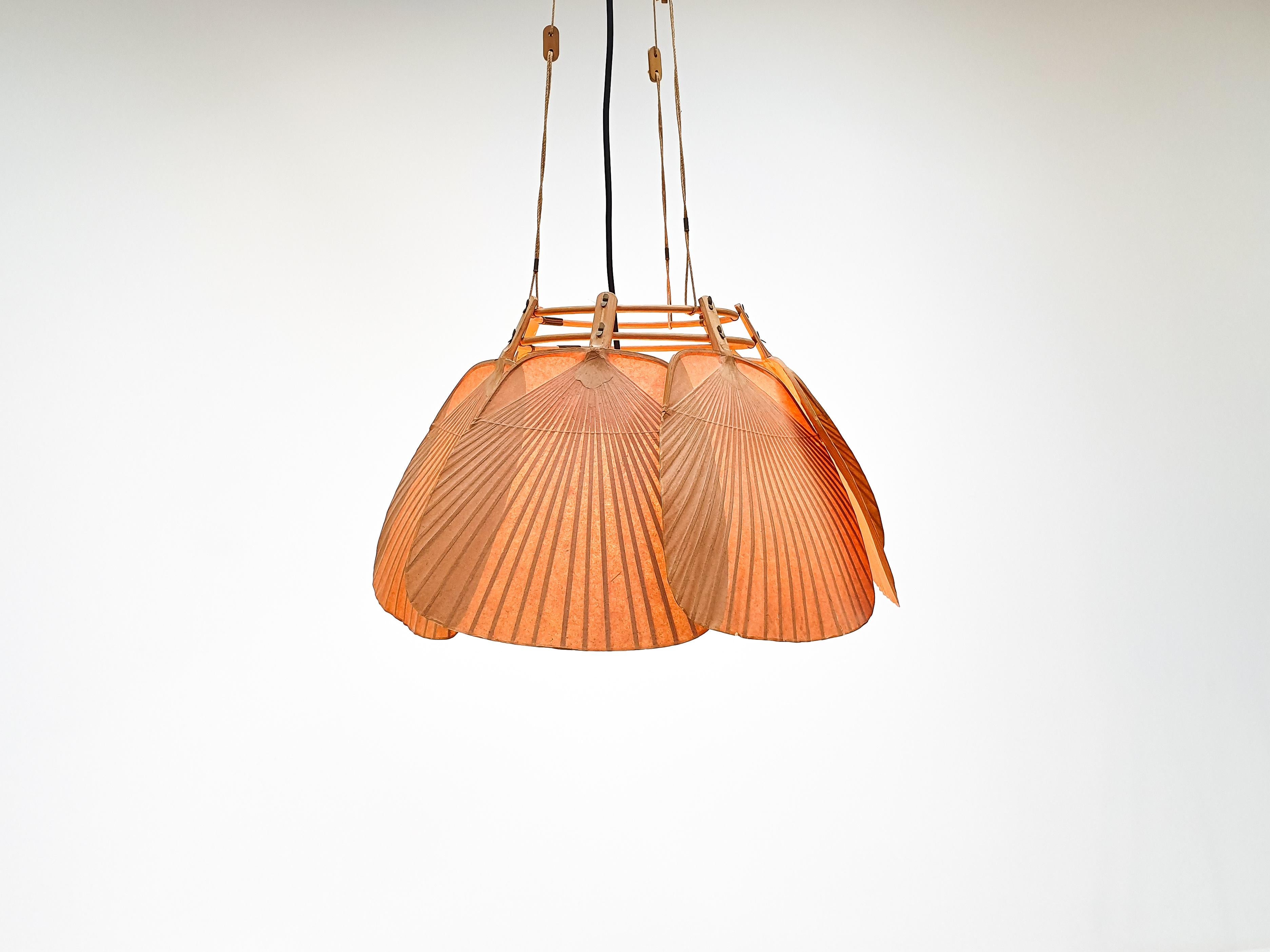 An ‘Uchiwa’ chandelier by Ingo Maurer created for M design during the 1970s. 

Uchiwa lamps were handmade from bamboo and Japanese rice paper and the designs drew inspiration from traditional Japanese fans.

The fixture is adjustable in height