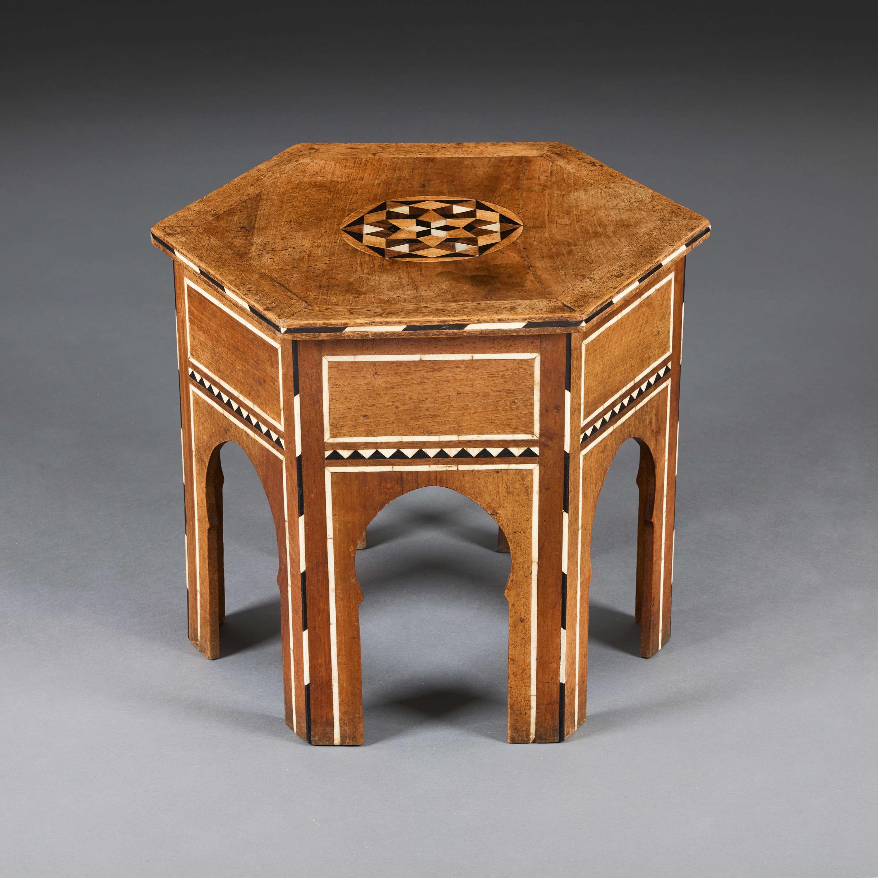 Ottoman, circa 1900

An unusual hexagonal Moorish occasional table inlaid with bone in star marquetry to the top and further geometric marquetry to the base. 

Height      44.00cm

Width       45.50cm

Depth       45.50cm