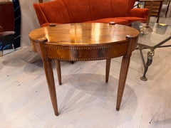 An inlaid satinwood occasional oval table