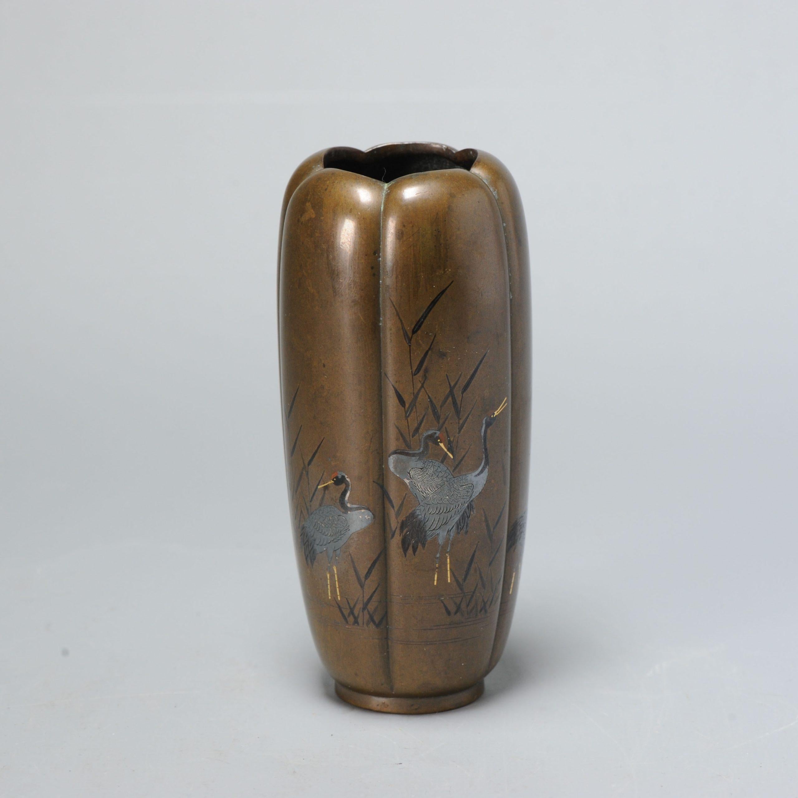 The scalloped vase (shape of a flower) inlaid with cranes on the waterfront. Beautiful craftmenship.

Unmarked.

Perfect condition. Size 120mm high
Period
20th century Meiji Periode (1867-1912)
Taisho Periode (1912-1926).