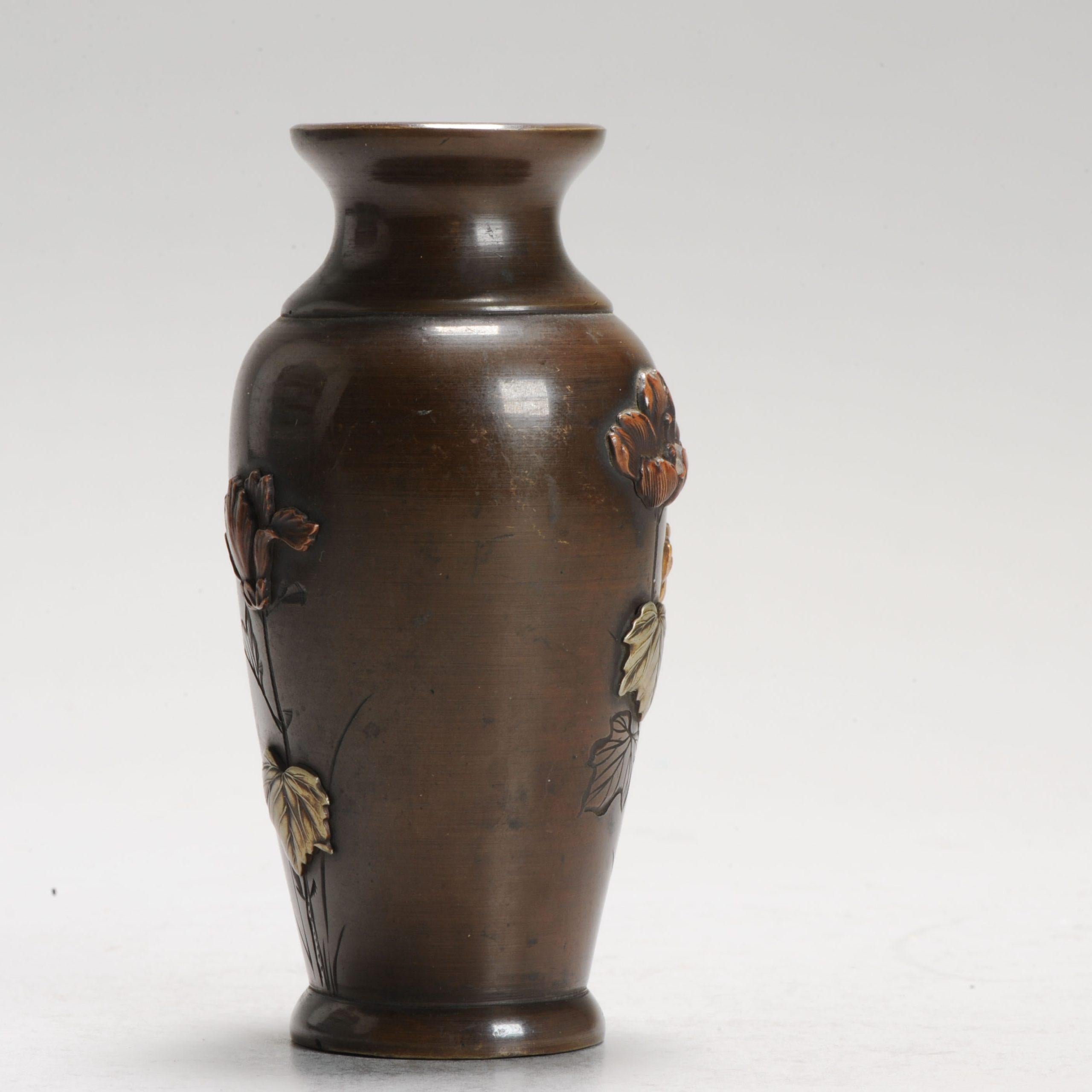 Meiji Period (1868-1912), Japan

A small vase with an inlaid scene of a bird and flowers in a garden.

Additional information:
Material: Bronze & Cloisonne
Region of Origin: Japan
Period: 19th century
Japan Dynasty Period: Meiji Period