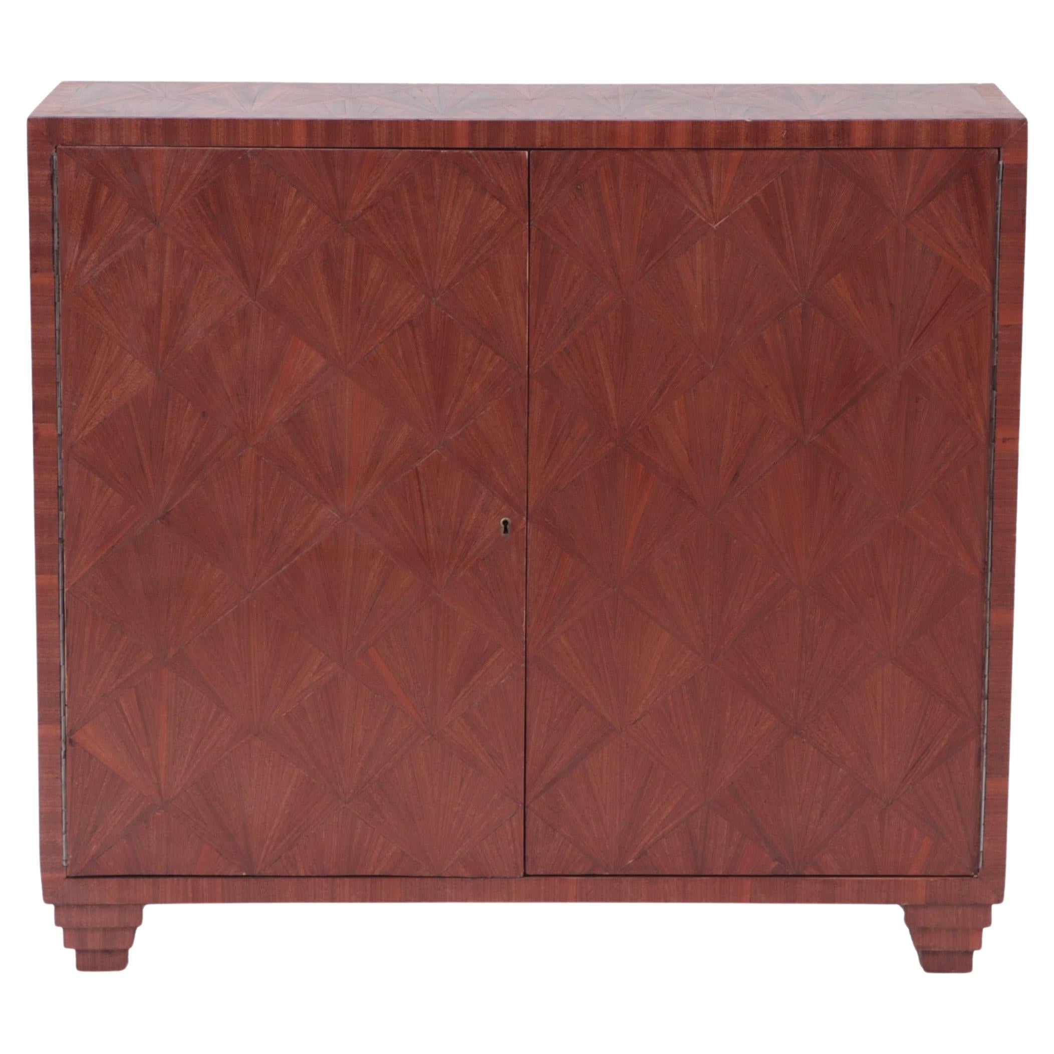 A beautiful inlaid two door cabinet in the manner of Jean-Michel Frank. Contemporary.