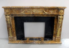 An Interesting 19th Century Gilt Bronze Mounted Giallo di Siena Marble Fireplace