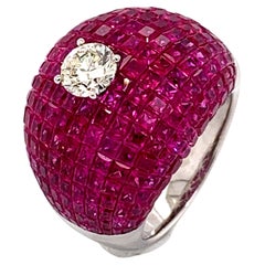 Bague en rubis à sertissage invisible de 22,17 carats, centrée sur un diamant de 0,73 carat