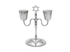 An Iraqi Silver Shabbat Candlestick Holder, circa 1920. Judaica