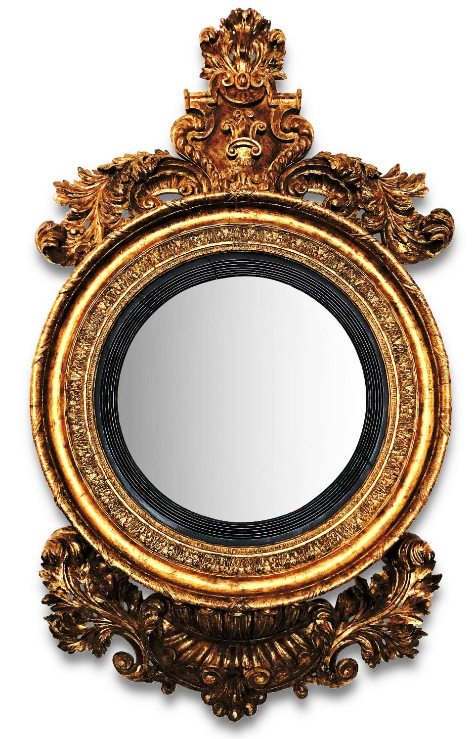 A monumental Irish George IV giltwood convex mirror.
A very large and impressive George IV giltwood convex mirror, the original circular convex mirror plate, with a black reeded ebonised border, inside a giltwood acanthus border. The top carved