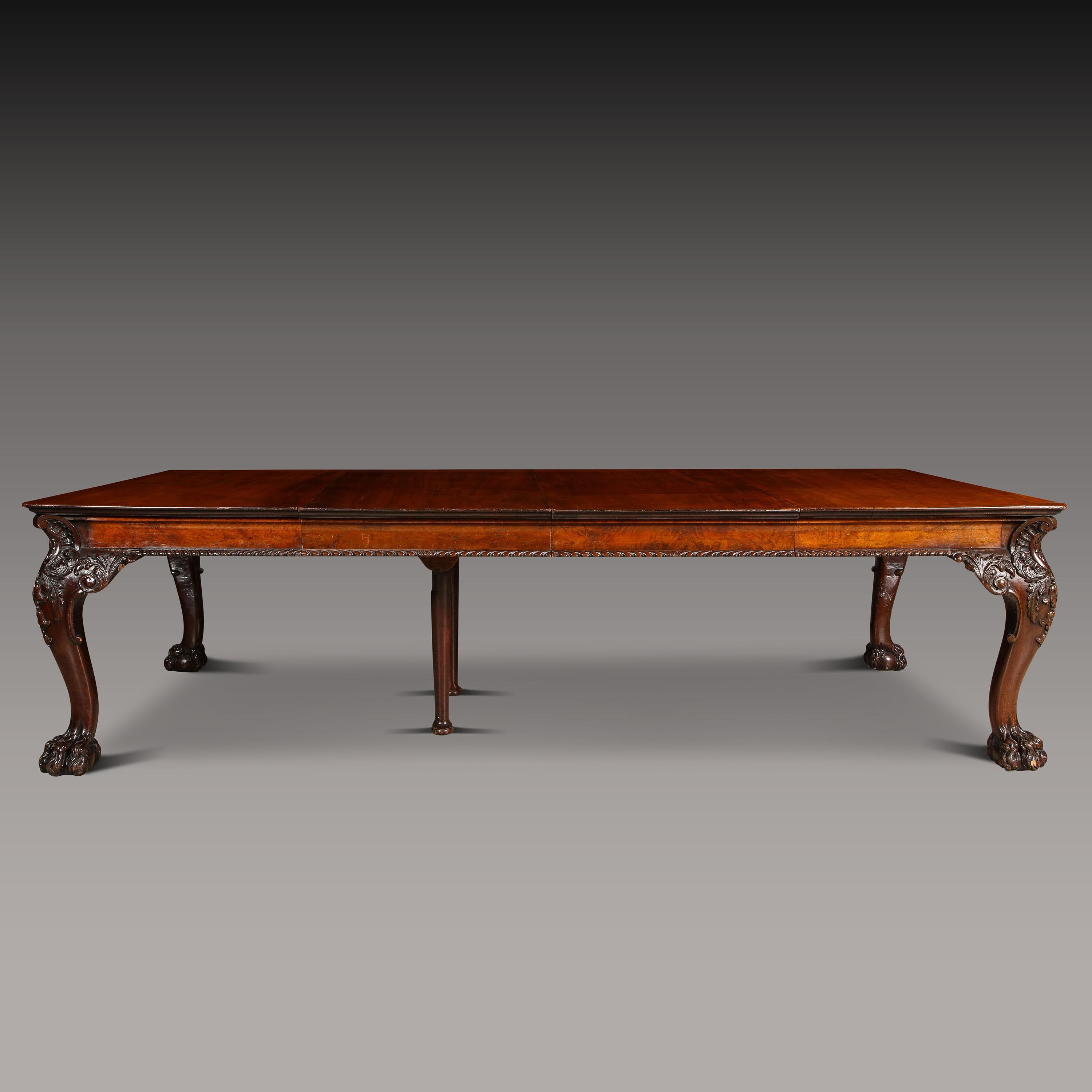 A Handsome Mahogany Irish extending dining table. Early to mid-19th century in William IV style.
Supported on four bold cabriole legs with an acanthus carved knee terminating in a hairy paw foot.
A burl veneer gadrooned apron supporting a solid