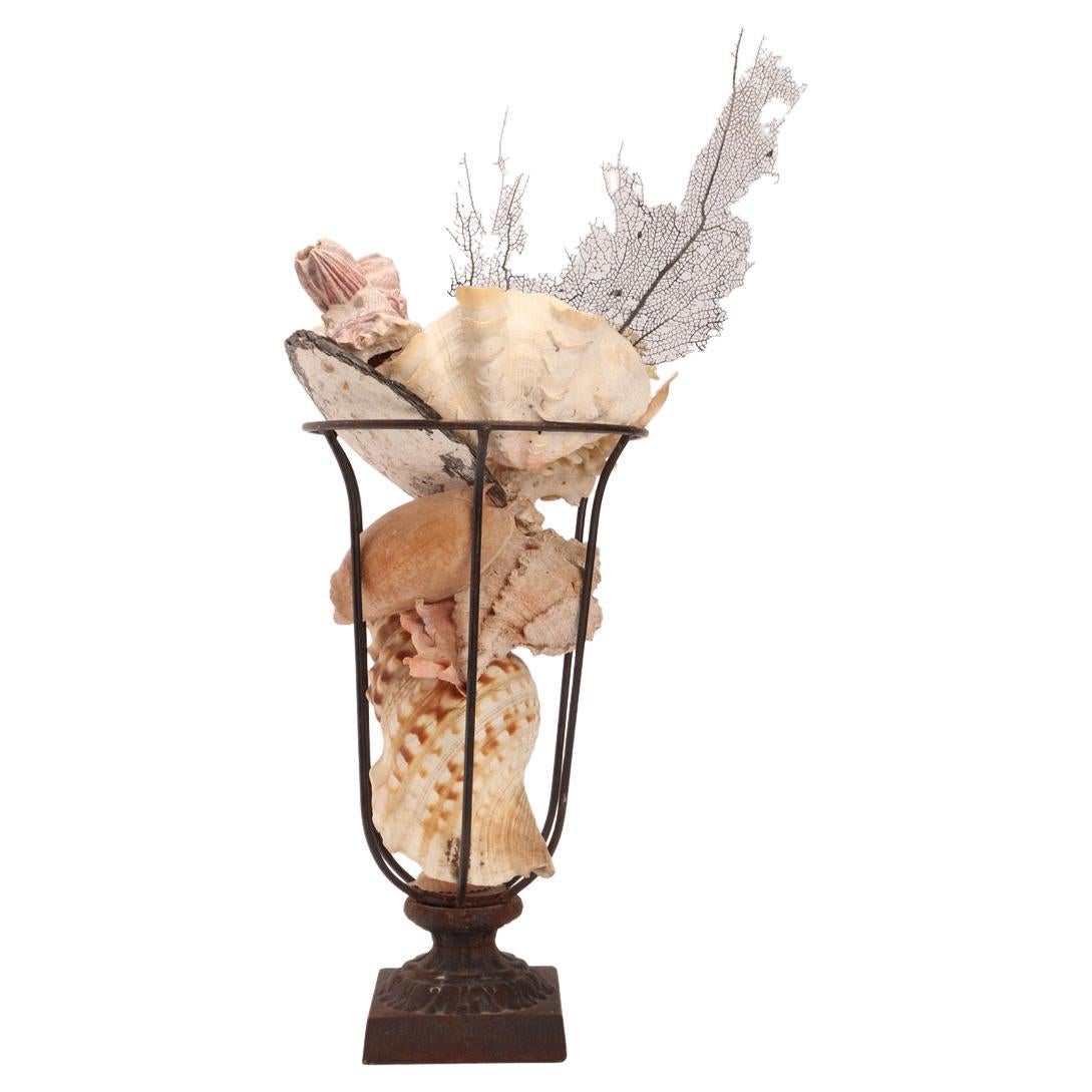 An iron vase full of shells, France circa 1890.  For Sale