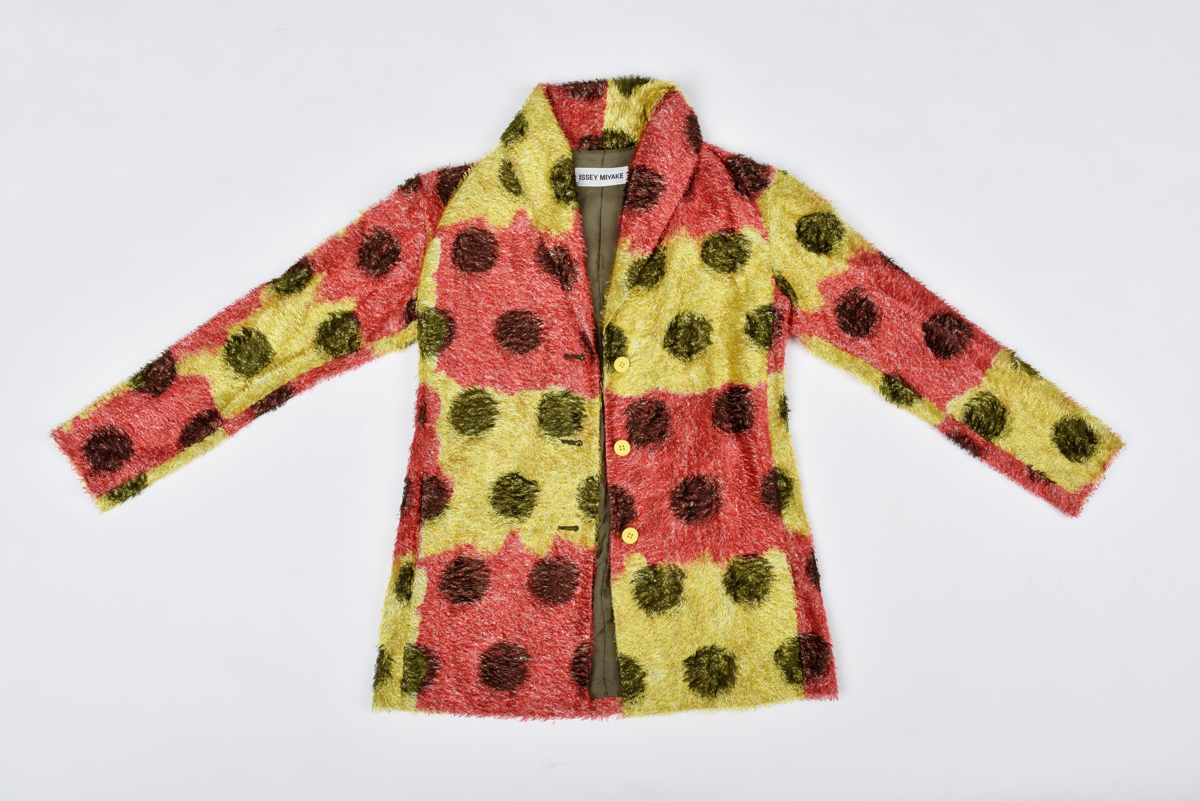 Winter 1998 Fall Collection

Japan

Rare iconic plush acrylic jacket by Issey Miyaké presented during the Winter 1998 collection fashion show. Light plush with long hair and large red and yellow checks dotted with large black polka dots. Loose fit