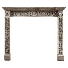 An Istrian Stone Chimneypiece with Grotesque Decoration