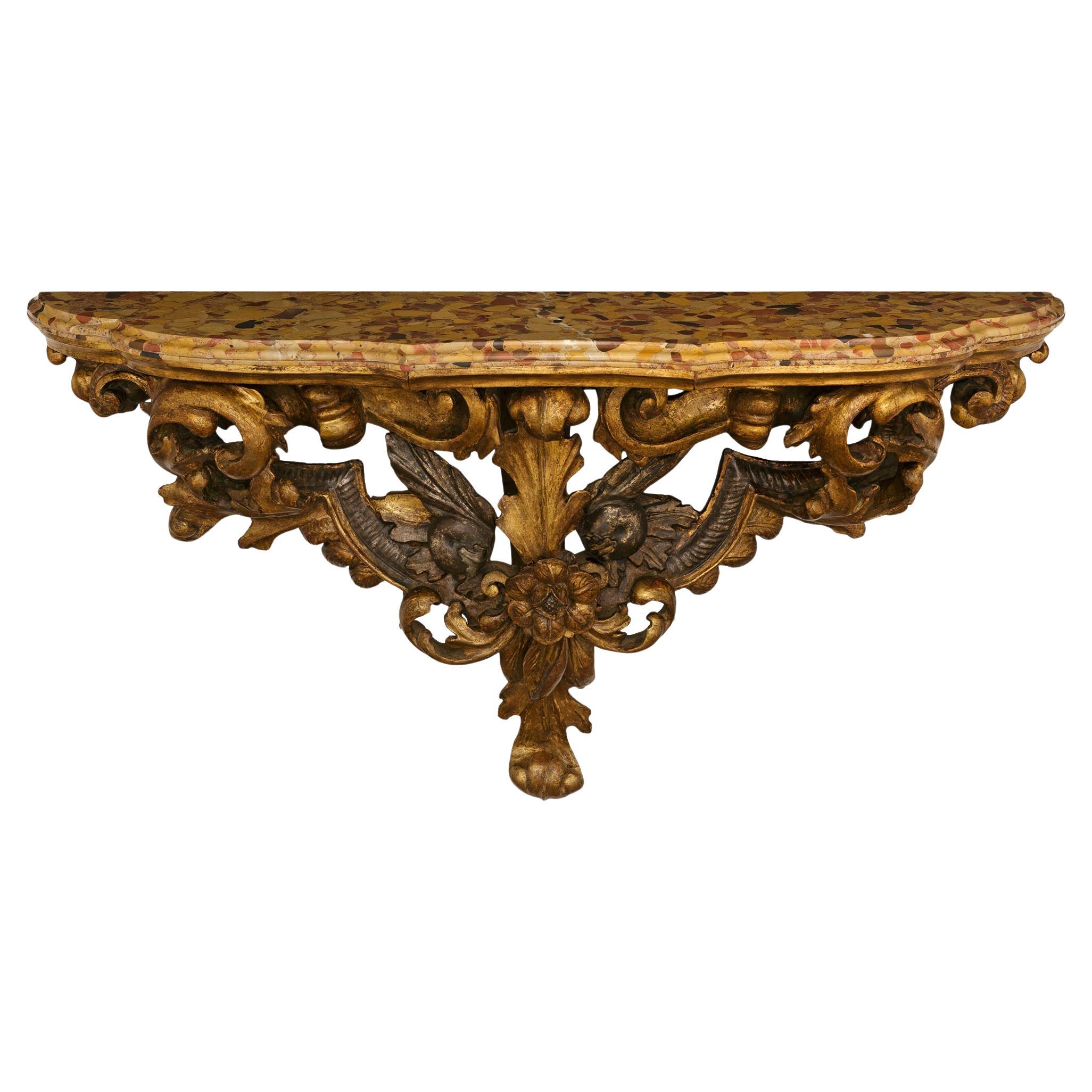 An Italian 18th century Giltwood, Mecca, and marble wall bracket/console For Sale