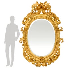 An Italian 18th century Baroque Period Giltwood mirror