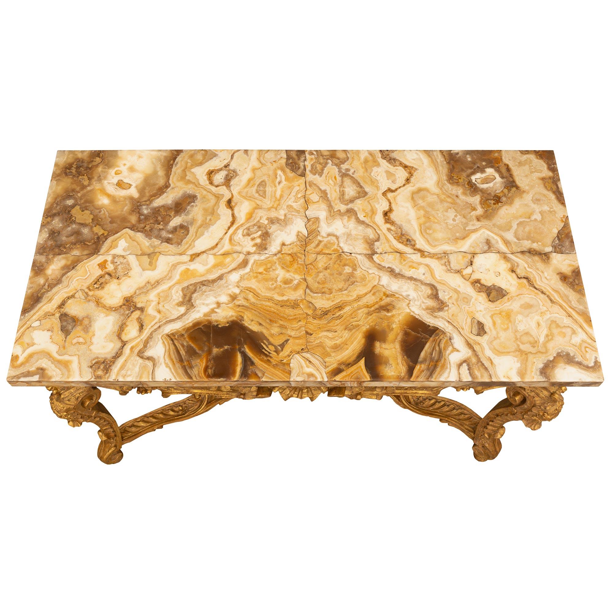 A stunning and most impressive Italian 18th century Louis XV period giltwood and Alabastro Fiorito marble console. The freestanding console is raised by beautiful elegant cabriole legs with fine scrolled feet and lovely reeded and richly carved