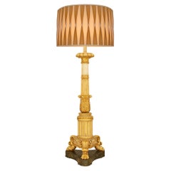 An Italian 18th century Neo-Classical st. Painted Wood and Giltwood floor lamp