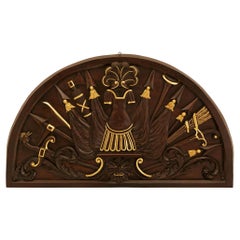 An Italian 18th century Neo-Classical st. patinated Wood and Giltwood plaque.