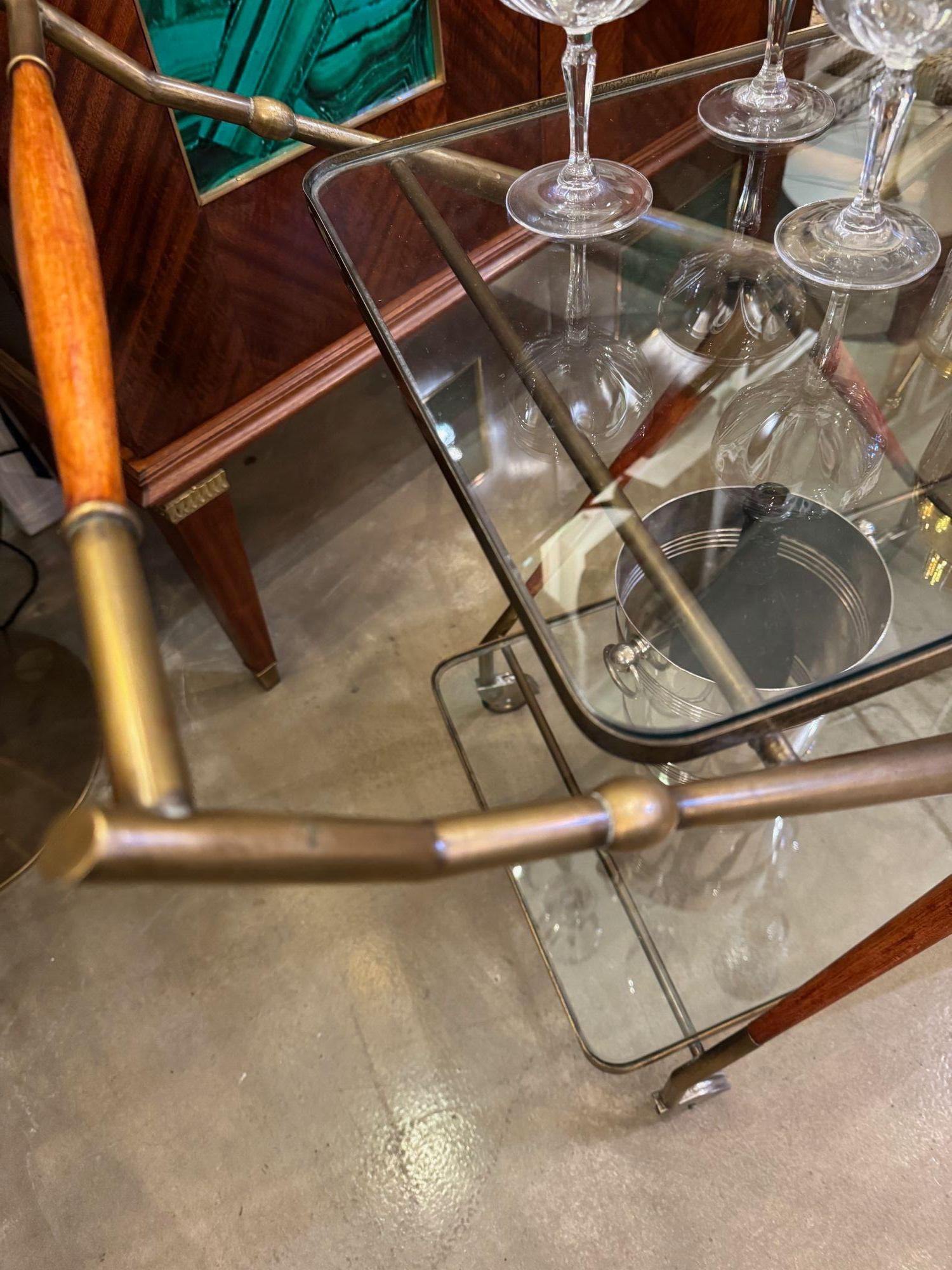 An Italian 1950s brass and lacquered wood bar trolley by Cesare Lacca For Sale 3