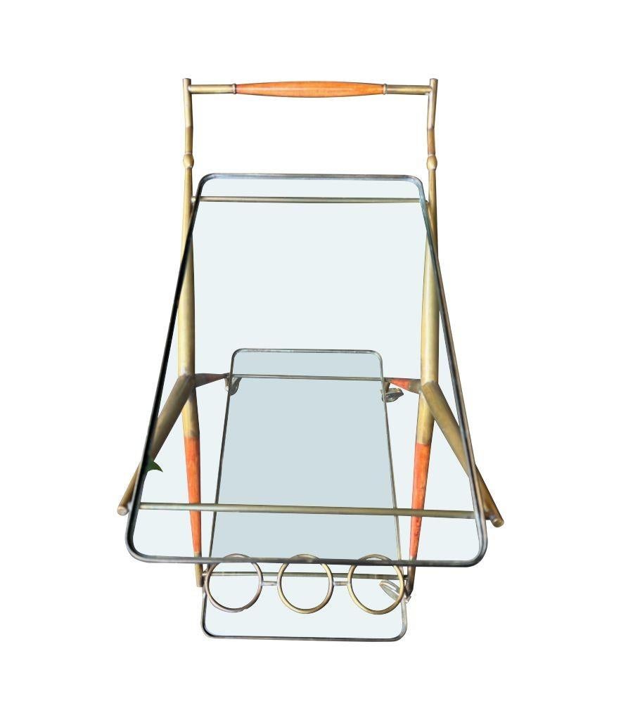 An Italian 1950s brass and lacquered wood bar trolley by Cesare Lacca For Sale 4
