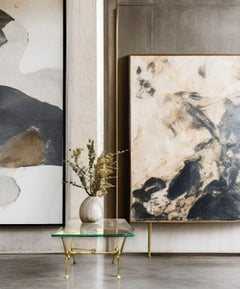 An Italian 1950s brass and thick glass cocktail table by Janetti, Florence