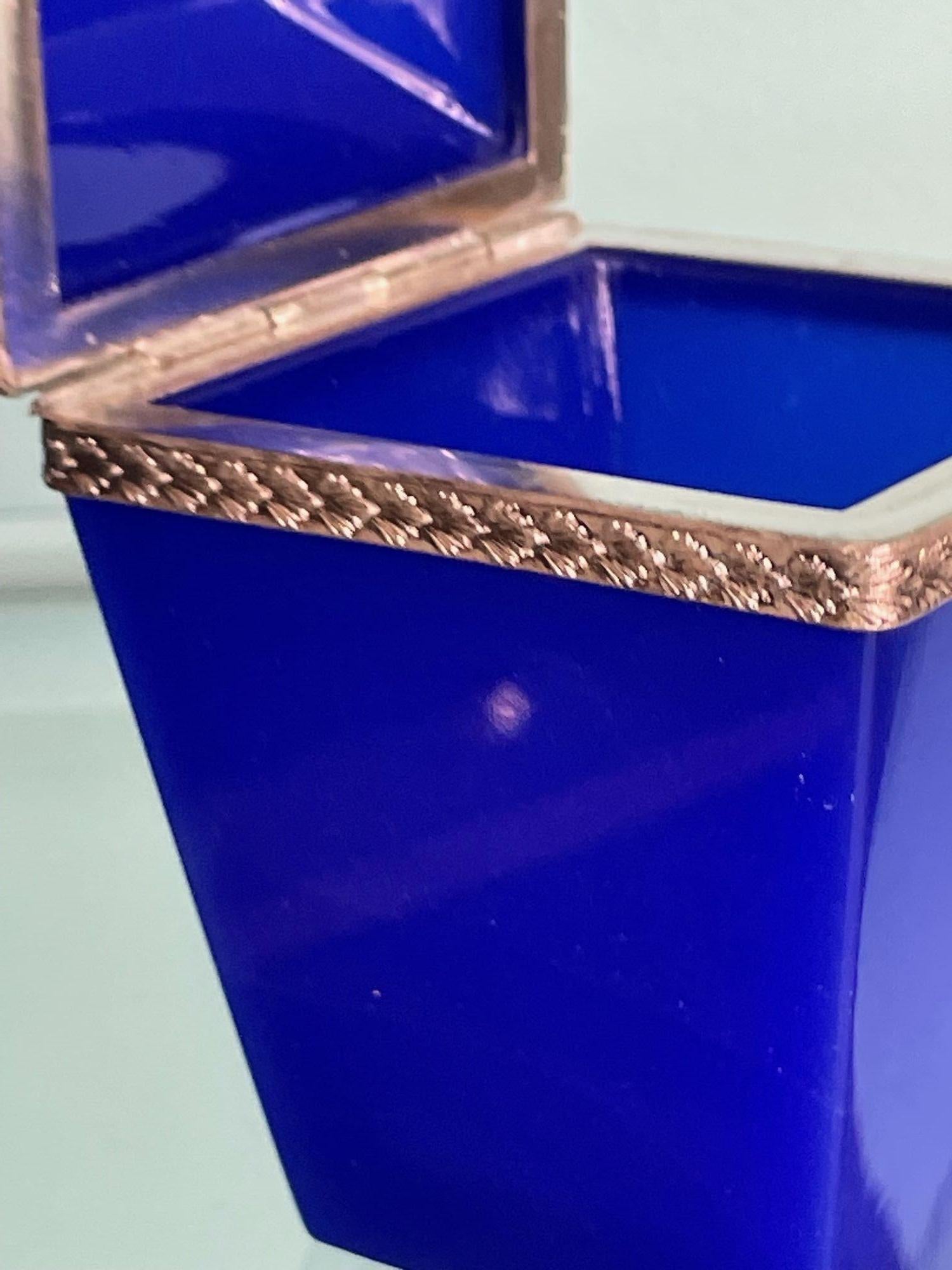 An Italian 1950s cobalt blue Murano glass hinged box with faceted lid and decorated metal edge detail by Giovanni Cenedese, Murano Italy